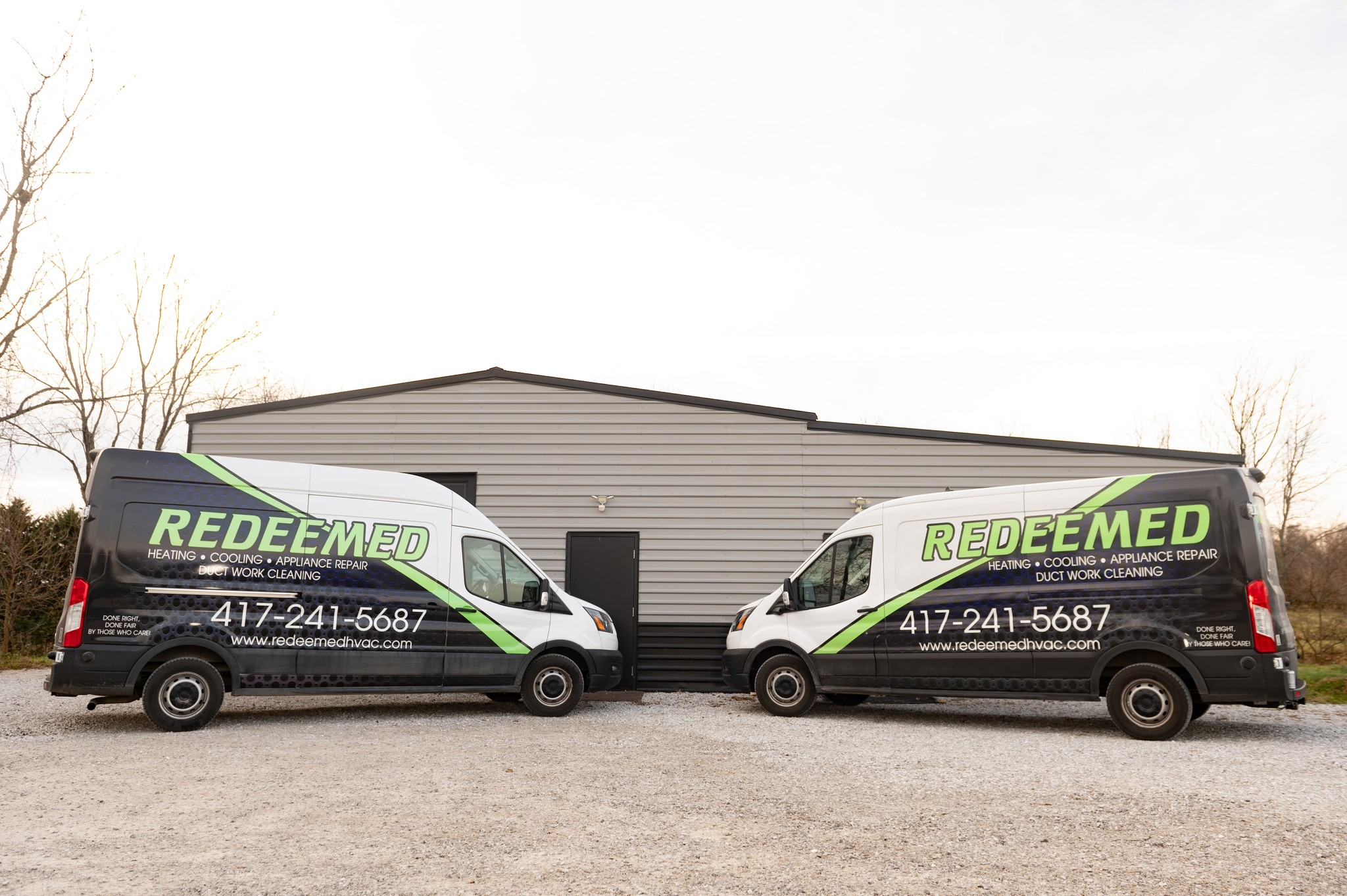 Redeemed HVAC service vans outside the company shop, ready for Nixa MO calls